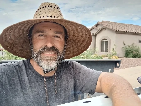 Odis Bynum owner of Bynum Tree and Landscape on a job site in Mesa, AZ